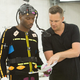 Director Mike Young gives notes to former NFL player Chad Ochocinco. (Photo via EA)